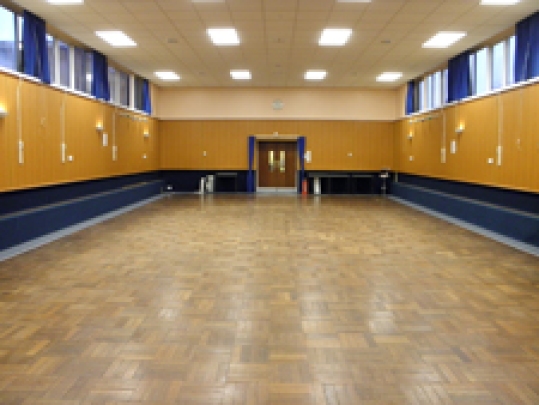 A hall with stage (off-screen)